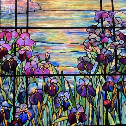 stained glass with purple irises by water